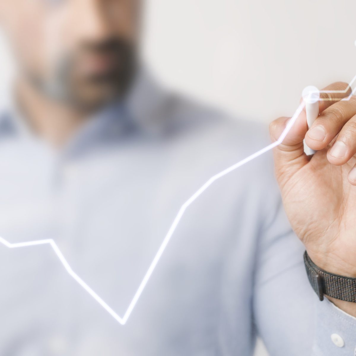 Man giving a business presentation using a futuristic digital pen